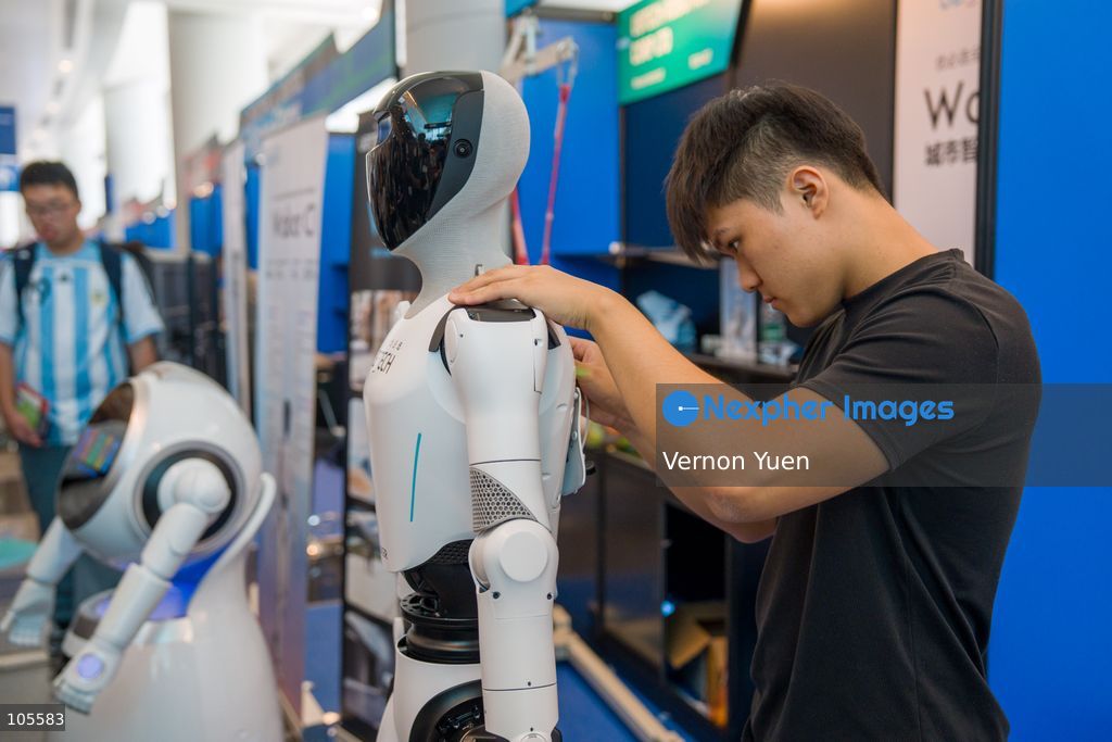 A worker working on a robot at the Hong Kong Electronics Fair on October 14, 2026 in Hong Kong. (Photo by Vernon Yuen/Nexpher Images)
