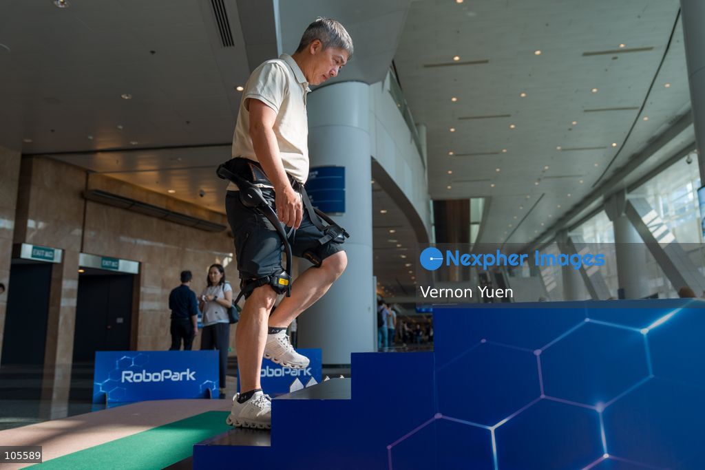 People trying a exoskeleton at the Hong Kong Electronics Fair on October 14, 2026 in Hong Kong. (Photo by Vernon Yuen/Nexpher Images)