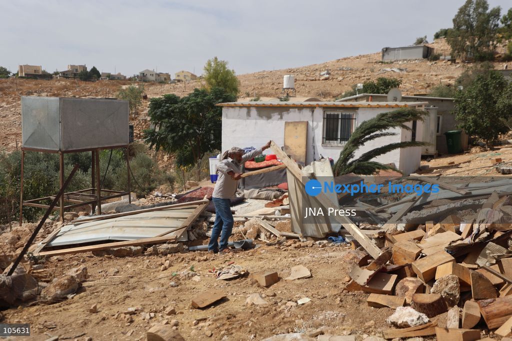 UMM AL-KHAIR, WEST BANK, PALESTINE, OCTOBER 14, 2026: Israeli forces demolish a Palestinian home and confiscate a portable toilet in Umm al-Khair, in Masafer Yatta, south of Hebron, in the occupied West Bank. The demolished dwelling housed a family of seven, according to Palestinian news agency WAFA. Photo by Mosab Shawer / JNA Press. (Photo by Mosab shawer/JNA Press via Nexpher Images)