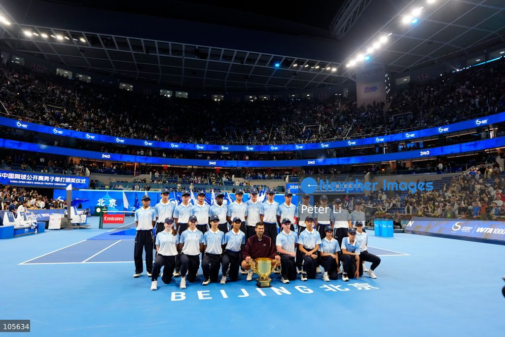 Novak Djokovic of Serbia poses with the trophy after winning against Alex De Minaur of Australia during their Men's Singles final match on day seven of China Open at the National Tennis Center on October 6, 2026 in Beijing, China. (Photo by Peter Li/Nexpher Images)