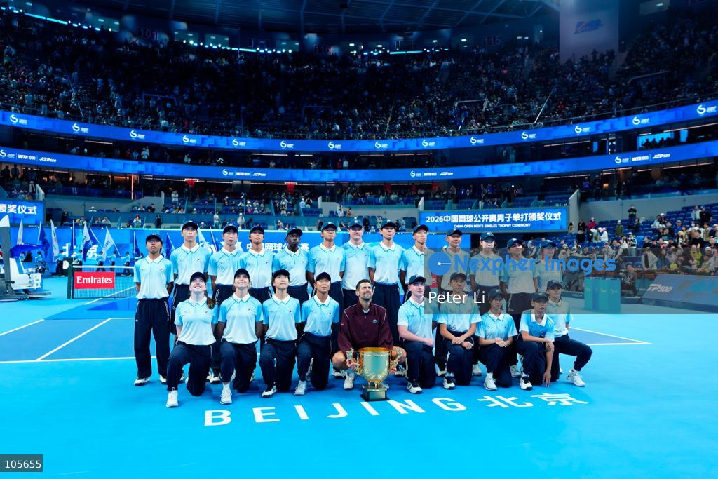 Novak Djokovic of Serbia poses with the trophy after winning against Alex De Minaur of Australia during their Men's Singles final match on day seven of China Open at the National Tennis Center on October 6, 2026 in Beijing, China. (Photo by Peter Li/Nexpher Images)