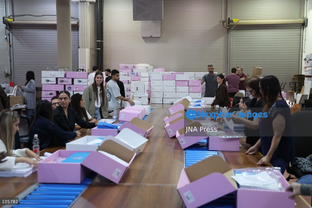 SHOHAM, ISRAEL, OCTOBER 14, 2026: Preparations for Israel’s upcoming parliamentary elections at the Central Elections Committee’s logistics centre in Shoham. Workers organise and pack voting materials and polling station equipment during a media tour of the facility. Photo by Saeed qaq / JNA PREES (Photo by Saeed Qaq/JNA Press via Nexpher Images)