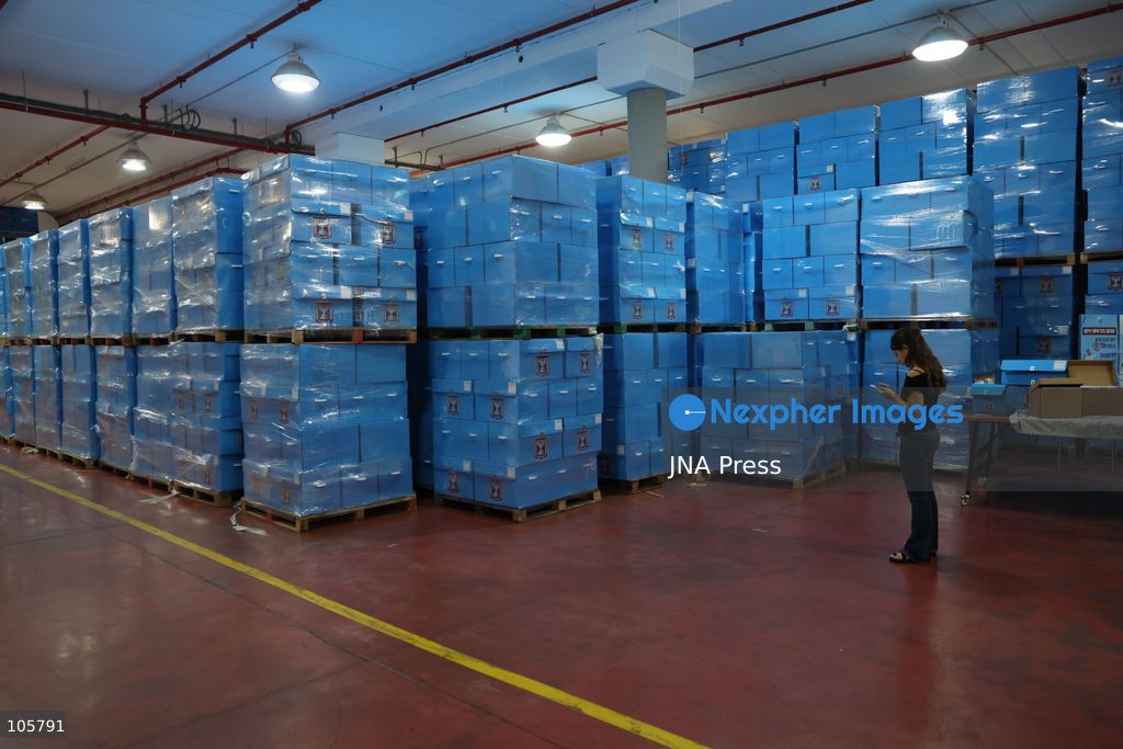 SHOHAM, ISRAEL, OCTOBER 14, 2026: Preparations for Israel’s upcoming parliamentary elections at the Central Elections Committee’s logistics centre in Shoham. Workers organise and pack voting materials and polling station equipment during a media tour of the facility. Photo by Saeed qaq / JNA PREES (Photo by Saeed Qaq/JNA Press via Nexpher Images)