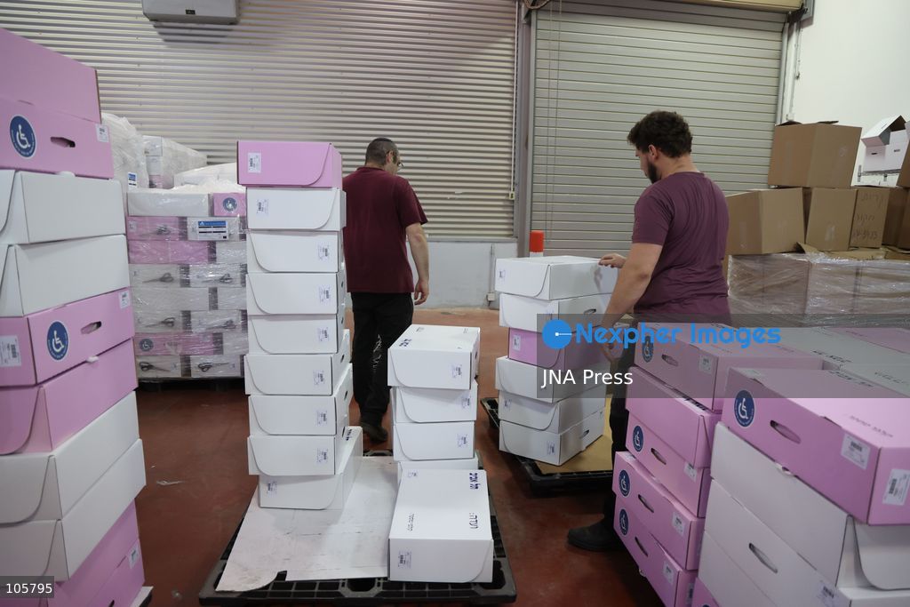 SHOHAM, ISRAEL, OCTOBER 14, 2026: Preparations for Israel’s upcoming parliamentary elections at the Central Elections Committee’s logistics centre in Shoham. Workers organise and pack voting materials and polling station equipment during a media tour of the facility. Photo by Saeed qaq / JNA PREES (Photo by Saeed Qaq/JNA Press via Nexpher Images)