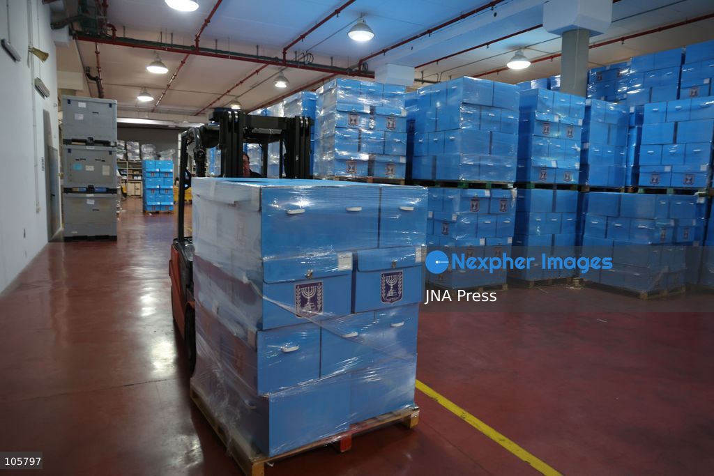 SHOHAM, ISRAEL, OCTOBER 14, 2026: Preparations for Israel’s upcoming parliamentary elections at the Central Elections Committee’s logistics centre in Shoham. Workers organise and pack voting materials and polling station equipment during a media tour of the facility. Photo by Saeed qaq / JNA PREES (Photo by Saeed Qaq/JNA Press via Nexpher Images)