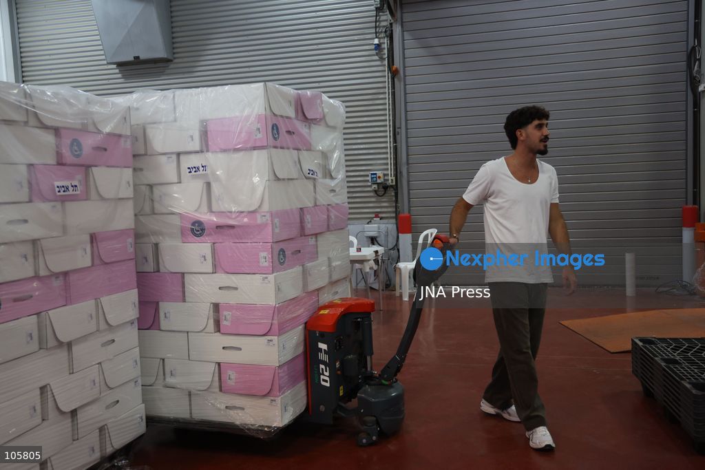 SHOHAM, ISRAEL, OCTOBER 14, 2026: Preparations for Israel’s upcoming parliamentary elections at the Central Elections Committee’s logistics centre in Shoham. Workers organise and pack voting materials and polling station equipment during a media tour of the facility. Photo by Saeed qaq / JNA PREES (Photo by Saeed Qaq/JNA Press via Nexpher Images)
