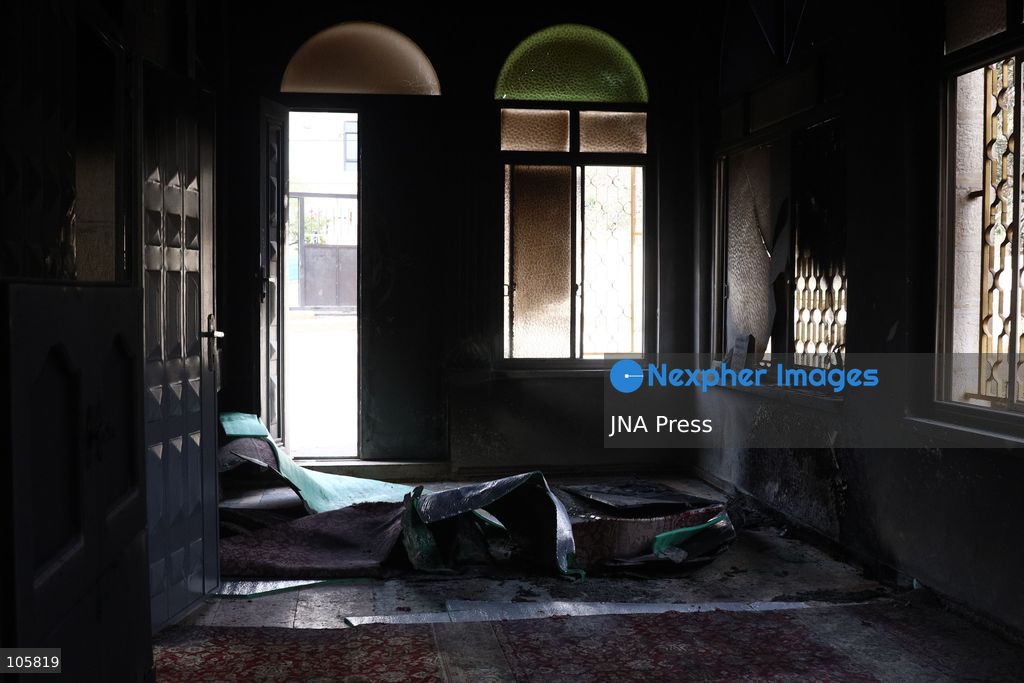 MUKHMAS, WEST BANK, PALESTINE, OCTOBER 14, 2026: Damage at the Sultan Ibrahim Mosque following an overnight arson attack in Mukhmas, northeast of Jerusalem, in the occupied West Bank. Israeli settlers set fire to parts of the mosque, a car and olive trees and spray-painted racist and threatening slogans on the mosque’s walls, according to Palestinian officials and the mosque’s imam. Photo by Salman Mohsen Alkhatib / JNA Press. (Photo by Salman Mohsen Alkhatib/JNA Press via Nexpher Images)