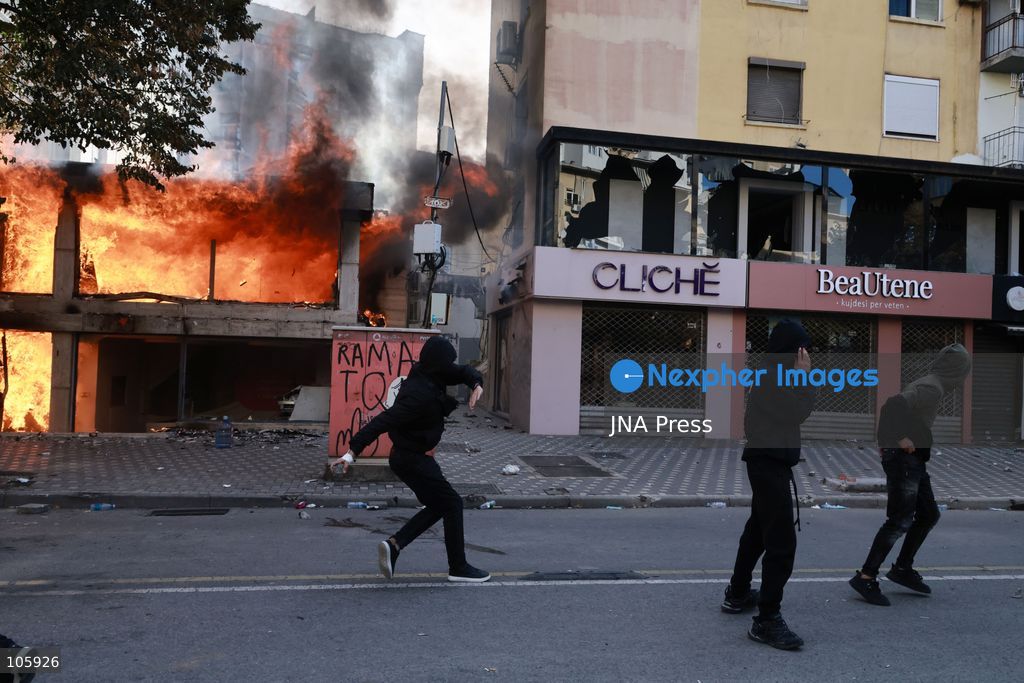 TIRANA, ALBANIA, OCTOBER 14, 2026: Demonstrators clash with riot police during student-led protests over rising education costs, university conditions and alleged corruption in Tirana. Fires damage the Ministry of Education and bank premises as protesters throw stones and other objects, while police use tear gas and water cannons. Photo by Vlasov Sulaj / JNA Press. (Photo by Vlasov Sulaj/JNA Press via Nexpher Images)