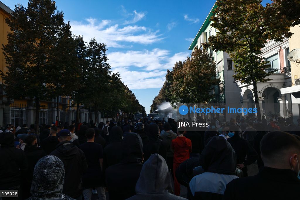 TIRANA, ALBANIA, OCTOBER 14, 2026: Demonstrators clash with riot police during student-led protests over rising education costs, university conditions and alleged corruption in Tirana. Fires damage the Ministry of Education and bank premises as protesters throw stones and other objects, while police use tear gas and water cannons. Photo by Vlasov Sulaj / JNA Press. (Photo by Vlasov Sulaj/JNA Press via Nexpher Images)