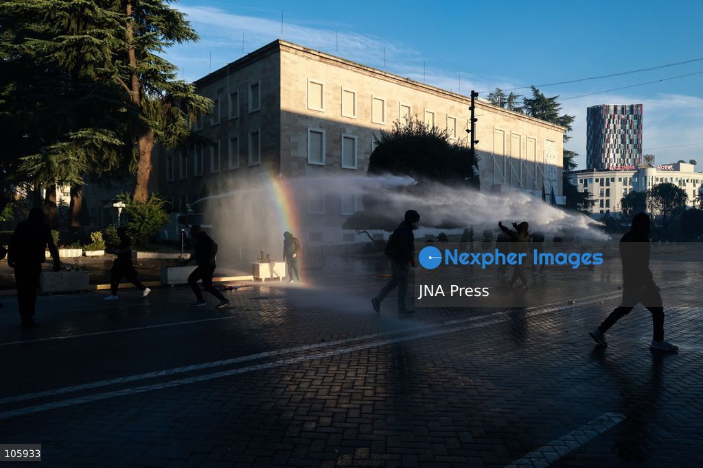 TIRANA, ALBANIA, OCTOBER 14, 2026: Demonstrators clash with riot police during student-led protests over rising education costs, university conditions and alleged corruption in Tirana. Fires damage the Ministry of Education and bank premises as protesters throw stones and other objects, while police use tear gas and water cannons. Photo by Vlasov Sulaj / JNA Press. (Photo by Vlasov Sulaj/JNA Press via Nexpher Images)