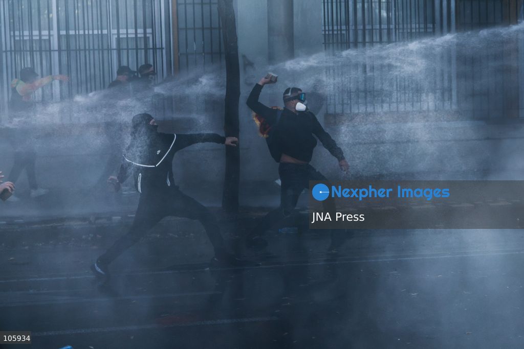 TIRANA, ALBANIA, OCTOBER 14, 2026: Demonstrators clash with riot police during student-led protests over rising education costs, university conditions and alleged corruption in Tirana. Fires damage the Ministry of Education and bank premises as protesters throw stones and other objects, while police use tear gas and water cannons. Photo by Vlasov Sulaj / JNA Press. (Photo by Vlasov Sulaj/JNA Press via Nexpher Images)