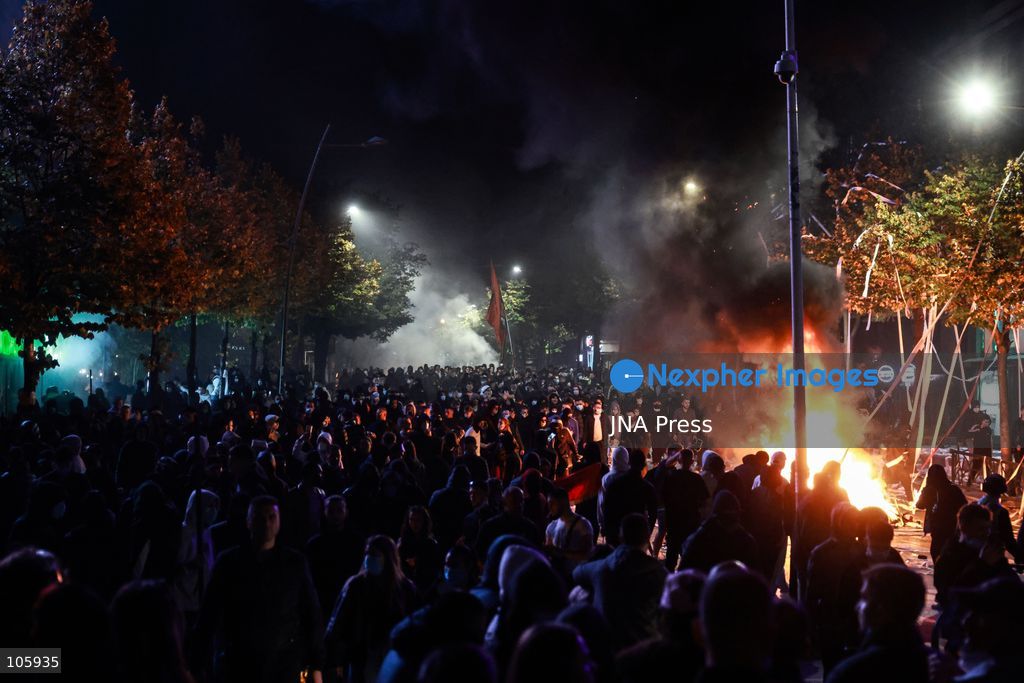 TIRANA, ALBANIA, OCTOBER 14, 2026: Demonstrators clash with riot police during student-led protests over rising education costs, university conditions and alleged corruption in Tirana. Fires damage the Ministry of Education and bank premises as protesters throw stones and other objects, while police use tear gas and water cannons. Photo by Vlasov Sulaj / JNA Press. (Photo by Vlasov Sulaj/JNA Press via Nexpher Images)