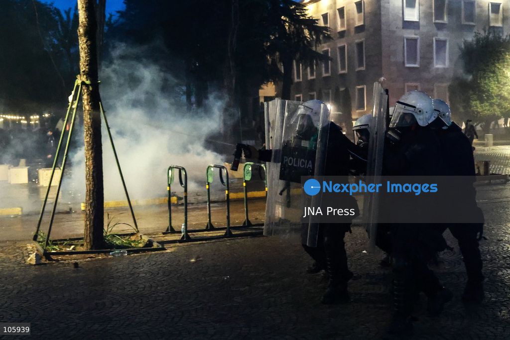 TIRANA, ALBANIA, OCTOBER 14, 2026: Demonstrators clash with riot police during student-led protests over rising education costs, university conditions and alleged corruption in Tirana. Fires damage the Ministry of Education and bank premises as protesters throw stones and other objects, while police use tear gas and water cannons. Photo by Vlasov Sulaj / JNA Press. (Photo by Vlasov Sulaj/JNA Press via Nexpher Images)