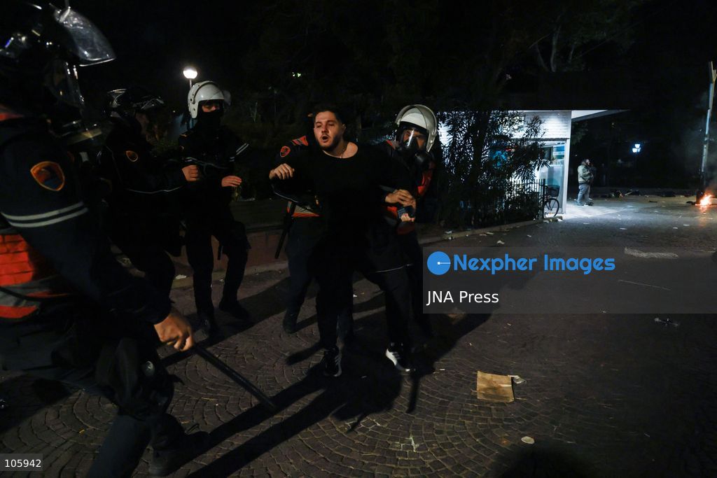 TIRANA, ALBANIA, OCTOBER 14, 2026: Demonstrators clash with riot police during student-led protests over rising education costs, university conditions and alleged corruption in Tirana. Fires damage the Ministry of Education and bank premises as protesters throw stones and other objects, while police use tear gas and water cannons. Photo by Vlasov Sulaj / JNA Press. (Photo by Vlasov Sulaj/JNA Press via Nexpher Images)