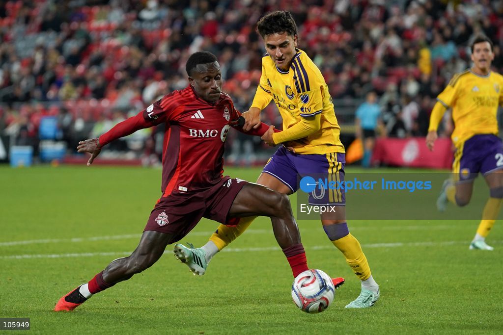 Richie Laryea #22 of Toronto FC and Eduard Atuesta #20 of Orlando City SC battle for the ball during the Major League Soccer Match between Toronto FC and Orlando City SC at BMO Field Stadium. on October 14, 2026 in Toronto, Canada. (Photo by Leonardo Ramirez/ Eyepix Group) (Photo by Leonardo Ramirez / Eyepix Group/Eyepix via Nexpher Images)