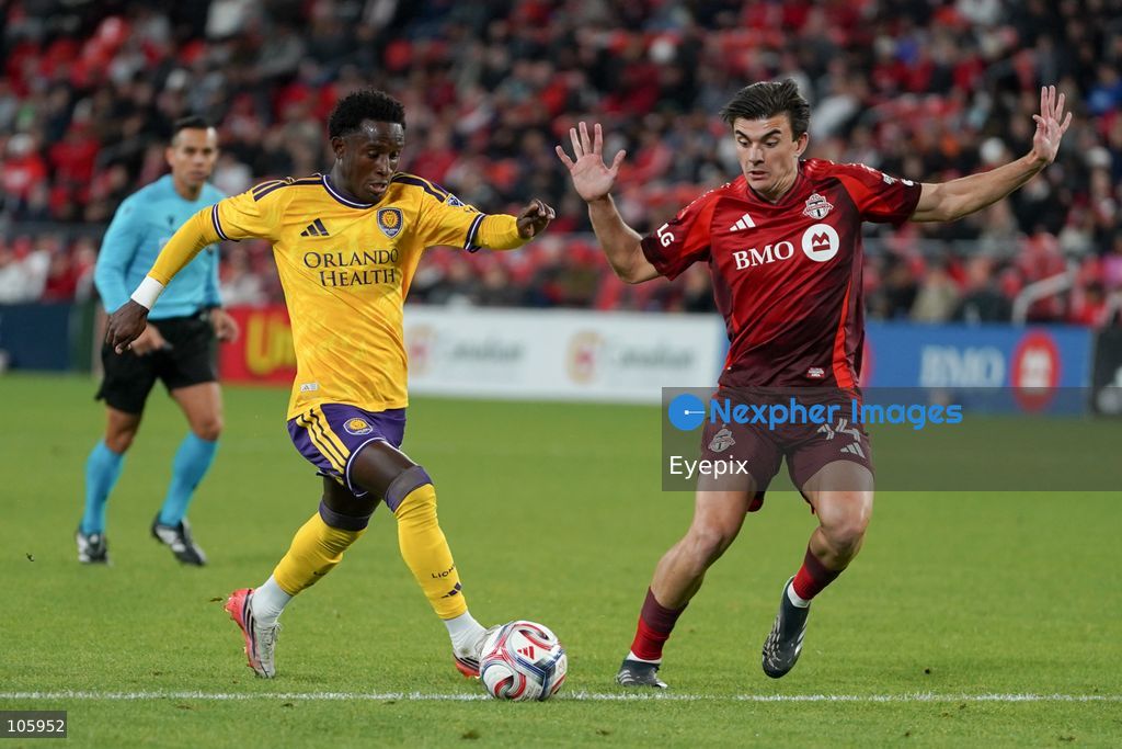 Ivan Angulo #77 of Orlando City SC and Alonso Coello #14 of Toronto FC battle for the ball during the Major League Soccer Match between Toronto FC and Orlando City SC at BMO Field Stadium. on October 14, 2026 in Toronto, Canada. (Photo by Leonardo Ramirez/ Eyepix Group) (Photo by Leonardo Ramirez / Eyepix Group/Eyepix via Nexpher Images)
