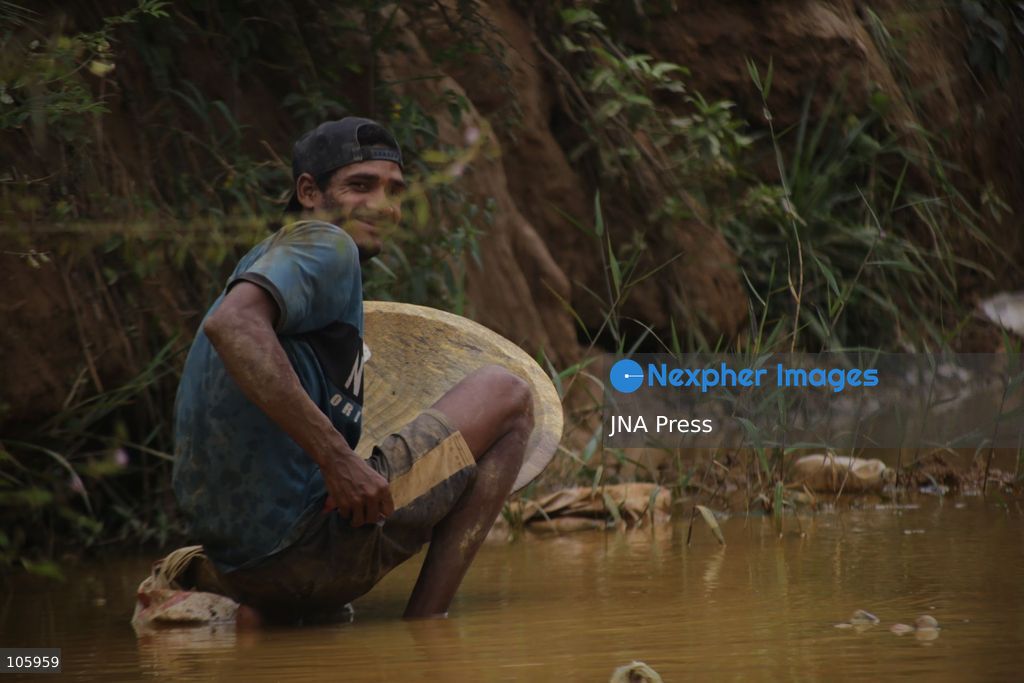LAS CLARITAS, VENEZUELA, OCTOBER 15, 2026: Informal miners pan for gold in muddy water in Las Claritas, in Venezuela’s Orinoco Mining Arc. The photographs document working conditions and livelihoods in small-scale gold mining. Photo by Moisés Quintero / JNA Press. (Photo by Moisés Quintero/JNA Press via Nexpher Images)