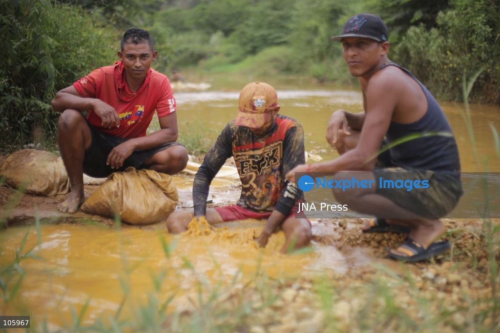 LAS CLARITAS, VENEZUELA, OCTOBER 15, 2026: Informal miners pan for gold in muddy water in Las Claritas, in Venezuela’s Orinoco Mining Arc. The photographs document working conditions and livelihoods in small-scale gold mining. Photo by Moisés Quintero / JNA Press. (Photo by Moisés Quintero/JNA Press via Nexpher Images)