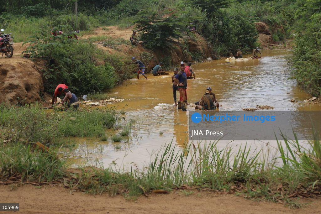 LAS CLARITAS, VENEZUELA, OCTOBER 15, 2026: Informal miners pan for gold in muddy water in Las Claritas, in Venezuela’s Orinoco Mining Arc. The photographs document working conditions and livelihoods in small-scale gold mining. Photo by Moisés Quintero / JNA Press. (Photo by Moisés Quintero/JNA Press via Nexpher Images)