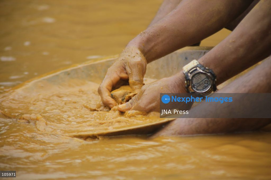 LAS CLARITAS, VENEZUELA, OCTOBER 15, 2026: Informal miners pan for gold in muddy water in Las Claritas, in Venezuela’s Orinoco Mining Arc. The photographs document working conditions and livelihoods in small-scale gold mining. Photo by Moisés Quintero / JNA Press. (Photo by Moisés Quintero/JNA Press via Nexpher Images)