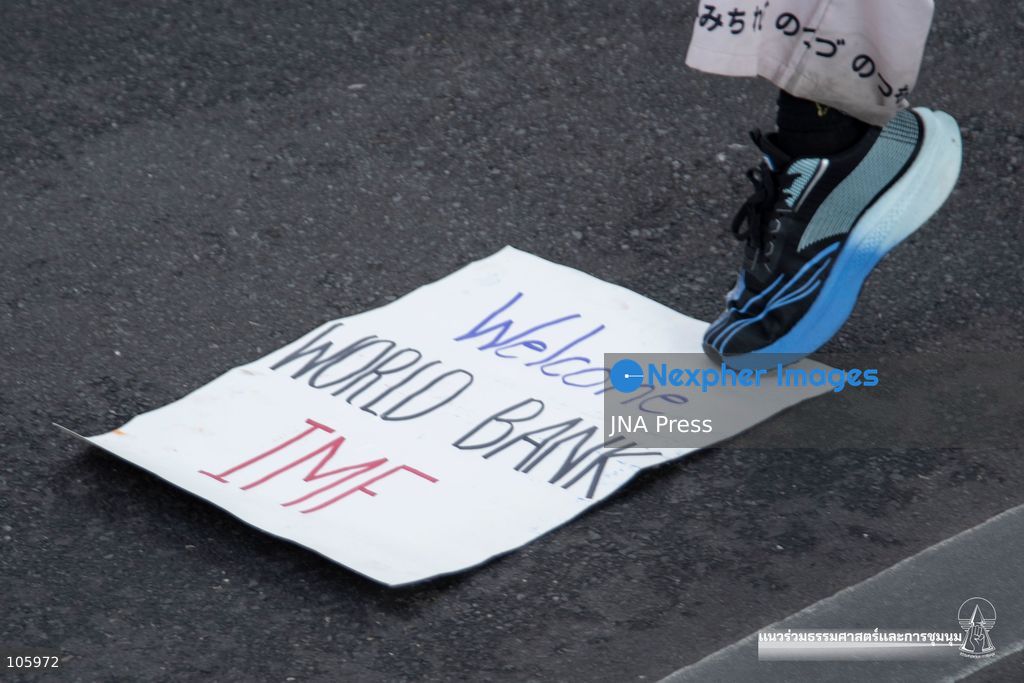 BANGKOK, THAILAND, OCTOBER 15, 2026: Civil society activists march in Bangkok to protest against the World Bank and the International Monetary Fund during their 2026 Annual Meetings. Demonstrators carry banners and signs opposing the institutions as organisers seek police permission to demonstrate outside the Queen Sirikit National Convention Center. Photo by Panawat Seangsotg / JNA Press. (Photo by Panawat Seangsotg/JNA Press via Nexpher Images)