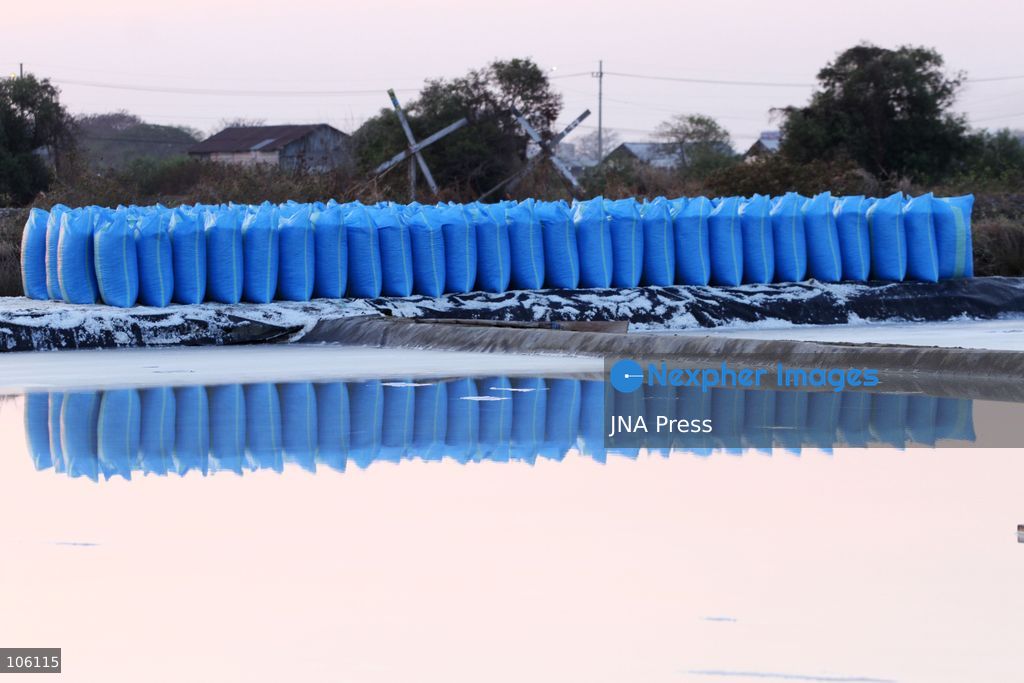 SIDOARJO, EAST JAVA, INDONESIA, OCTOBER 15, 2026: A worker harvests salt from evaporation ponds in Sedati district, Sidoarjo, East Java. Indonesia is seeking to expand domestic salt production and improve quality as part of its target to achieve salt self-sufficiency by 2027. Photo by Patrik Cahyo Lumintu / JNA Press. (Photo by Patrik Cahyo Lumintu/JNA Press via Nexpher Images)