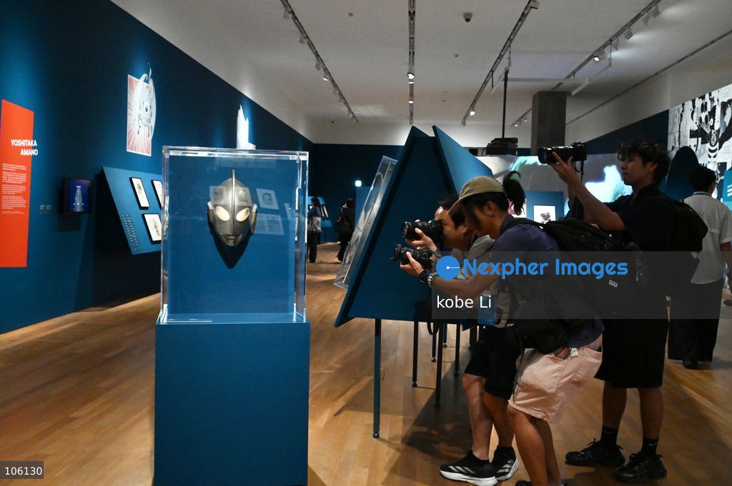 Photographers taking photo with Ultraman exhibit, the "Myths and Monsters: The Art of Fantasy in Asia" exhibition opening at Hong Kong’s M+. on October 15, 2026 in Hong Kong.