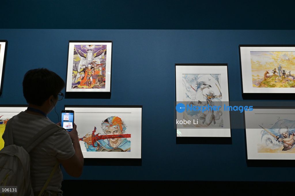 A visitor taking photo with exhibits, the "Myths and Monsters: The Art of Fantasy in Asia" exhibition opening at Hong Kong’s M+. on October 15, 2026 in Hong Kong.