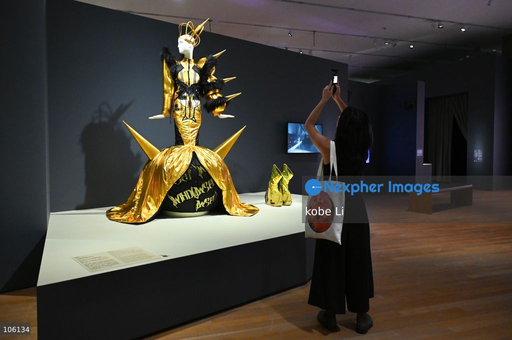 A visitor taking photo with Reincarnation of Mx. Ridiculous exhibit, the "Myths and Monsters: The Art of Fantasy in Asia" exhibition opening at Hong Kong’s M+. on October 15, 2026 in Hong Kong.