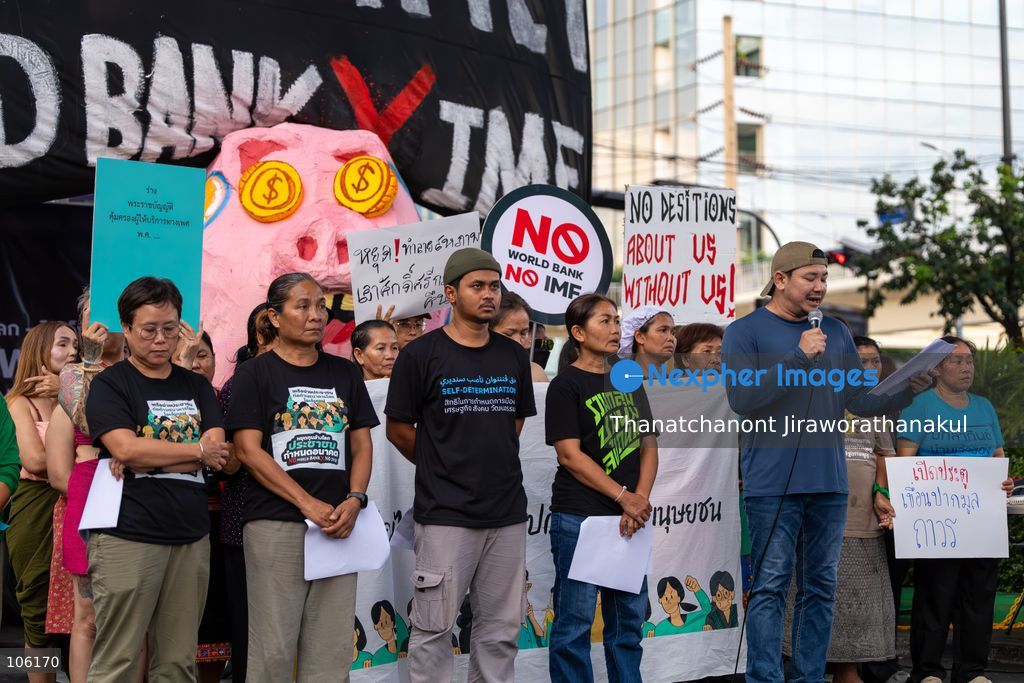 BANGKOK, THAILAND — October 15, 2026 — Members of the People’s Network Against the World Bank and IMF gathered at Rama IV intersection to protest the 2026 IMF–World Bank Group Annual Meetings in Bangkok. The demonstration highlighted concerns about economic inequality, rising household debt, environmental degradation and the effects of development policies on communities across Thailand. Police blocked the demonstrators from proceeding toward the Queen Sirikit National Convention Center, where the international meetings were taking place. Protesters continued their activities and speeches despite heavy rain, while security measures remained in place around the venue. (Photo by Thanatchanont Jiraworathanakul/Nexpher Images)