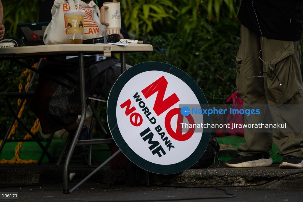 BANGKOK, THAILAND — October 15, 2026 — Members of the People’s Network Against the World Bank and IMF gathered at Rama IV intersection to protest the 2026 IMF–World Bank Group Annual Meetings in Bangkok. The demonstration highlighted concerns about economic inequality, rising household debt, environmental degradation and the effects of development policies on communities across Thailand. Police blocked the demonstrators from proceeding toward the Queen Sirikit National Convention Center, where the international meetings were taking place. Protesters continued their activities and speeches despite heavy rain, while security measures remained in place around the venue. (Photo by Thanatchanont Jiraworathanakul/Nexpher Images)