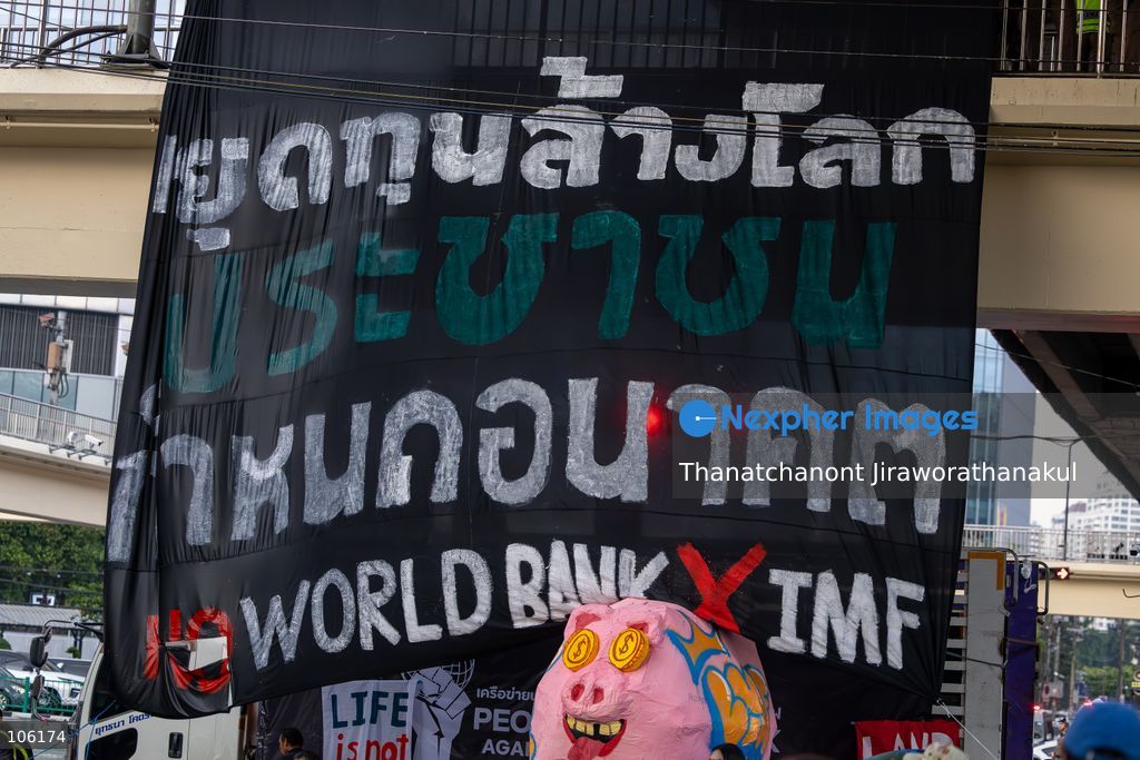 BANGKOK, THAILAND — October 15, 2026 — Members of the People’s Network Against the World Bank and IMF gathered at Rama IV intersection to protest the 2026 IMF–World Bank Group Annual Meetings in Bangkok. The demonstration highlighted concerns about economic inequality, rising household debt, environmental degradation and the effects of development policies on communities across Thailand. Police blocked the demonstrators from proceeding toward the Queen Sirikit National Convention Center, where the international meetings were taking place. Protesters continued their activities and speeches despite heavy rain, while security measures remained in place around the venue. (Photo by Thanatchanont Jiraworathanakul/Nexpher Images)
