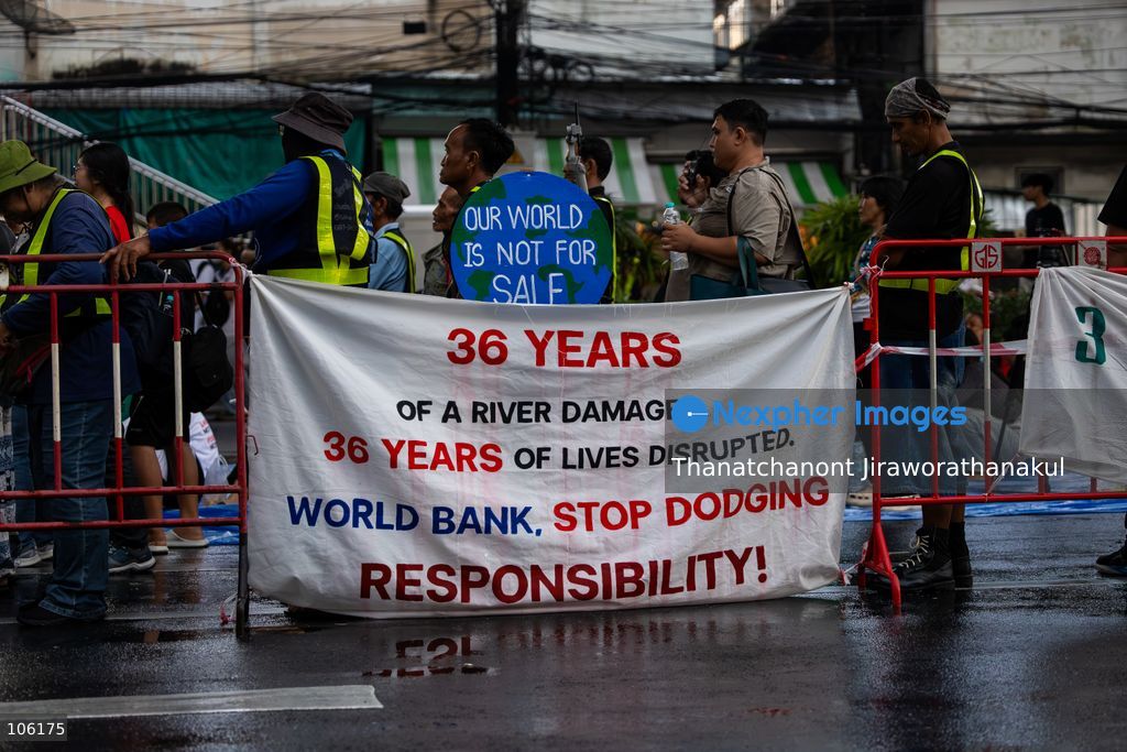 BANGKOK, THAILAND — October 15, 2026 — Members of the People’s Network Against the World Bank and IMF gathered at Rama IV intersection to protest the 2026 IMF–World Bank Group Annual Meetings in Bangkok. The demonstration highlighted concerns about economic inequality, rising household debt, environmental degradation and the effects of development policies on communities across Thailand. Police blocked the demonstrators from proceeding toward the Queen Sirikit National Convention Center, where the international meetings were taking place. Protesters continued their activities and speeches despite heavy rain, while security measures remained in place around the venue. (Photo by Thanatchanont Jiraworathanakul/Nexpher Images)