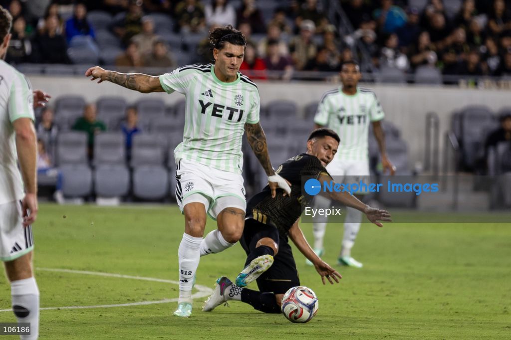 Brandon Vázquez #9 of Austin FC and Mark Delgado #8 of Los Angeles FC battle for the ball during the matchday 30 of Major League Soccer between Los Angeles Football Club and Austin FC at BMO Stadium on October 14, 2026 in Los Angeles, California. (Photo by Arturo Cordero / Eyepix Group) (Photo by Arturo Cordero / Eyepix Group/Eyepix via Nexpher Images)