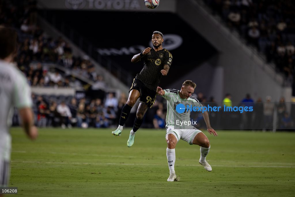 Denis Bouanga #99 of Los Angeles FC and Oleksandr Svatok #5 of Austin FC battle for the header during the matchday 30 of Major League Soccer between Los Angeles Football Club and Austin FC at BMO Stadium on October 14, 2026 in Los Angeles, California. (Photo by Arturo Cordero / Eyepix Group) (Photo by Arturo Cordero / Eyepix Group/Eyepix via Nexpher Images)