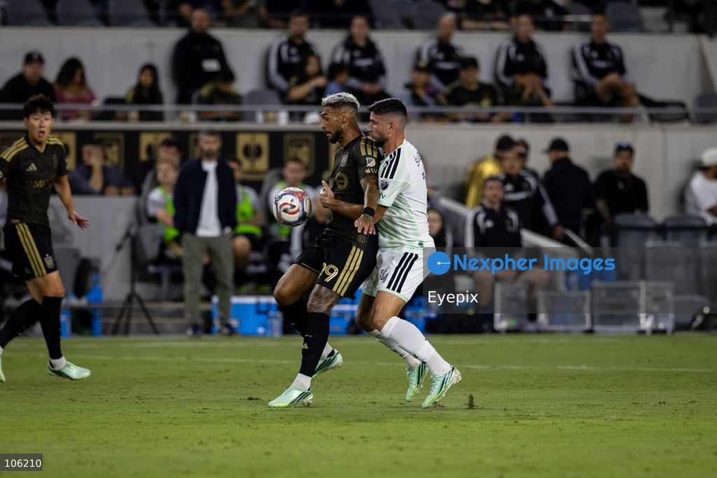 Denis Bouanga #99 of Los Angeles FC is pressured by Besard Sabovic #14 of Austin FC during the matchday 30 of Major League Soccer between Los Angeles Football Club and Austin FC at BMO Stadium on October 14, 2026 in Los Angeles, California. (Photo by Arturo Cordero / Eyepix Group) (Photo by Arturo Cordero / Eyepix Group/Eyepix via Nexpher Images)
