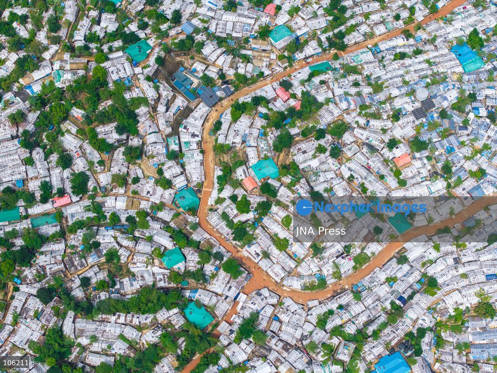 UKHIYA, COX’S BAZAR, BANGLADESH — OCTOBER 14, 2026: Aerial views show densely packed shelters and winding pathways across the Kutupalong Rohingya refugee camp in Ukhiya, Cox’s Bazar, Bangladesh. The photographs document the extensive settlement, where thousands of shelters are clustered across a hilly landscape interspersed with vegetation and access roads. (Photo by Istiyak Ahamed Srabon/JNA Press via Nexpher Images)