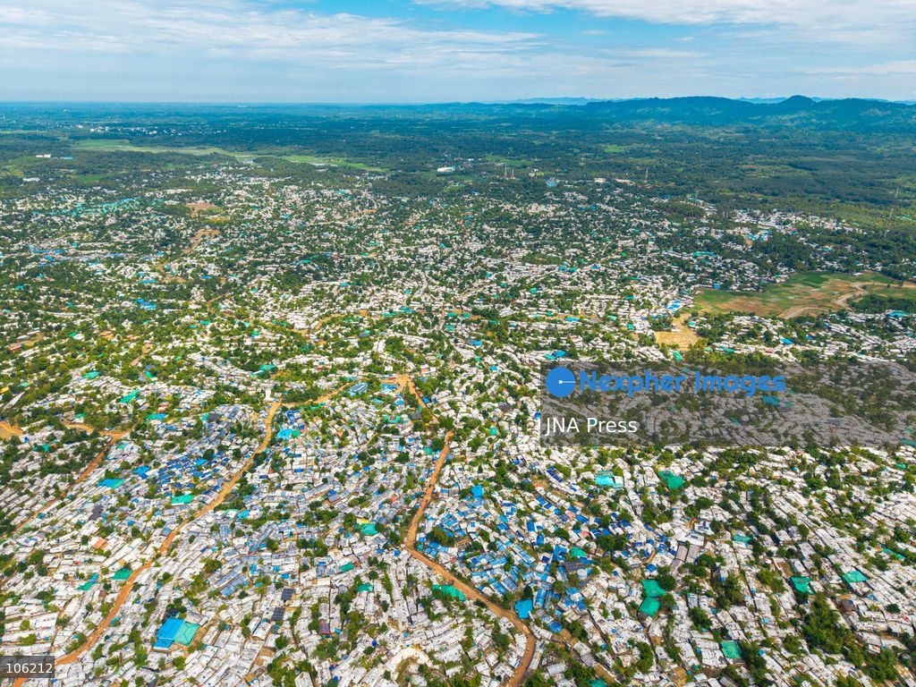 UKHIYA, COX’S BAZAR, BANGLADESH — OCTOBER 14, 2026: Aerial views show densely packed shelters and winding pathways across the Kutupalong Rohingya refugee camp in Ukhiya, Cox’s Bazar, Bangladesh. The photographs document the extensive settlement, where thousands of shelters are clustered across a hilly landscape interspersed with vegetation and access roads. (Photo by Istiyak Ahamed Srabon/JNA Press via Nexpher Images)