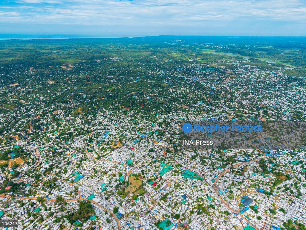 UKHIYA, COX’S BAZAR, BANGLADESH — OCTOBER 14, 2026: Aerial views show densely packed shelters and winding pathways across the Kutupalong Rohingya refugee camp in Ukhiya, Cox’s Bazar, Bangladesh. The photographs document the extensive settlement, where thousands of shelters are clustered across a hilly landscape interspersed with vegetation and access roads. (Photo by Istiyak Ahamed Srabon/JNA Press via Nexpher Images)