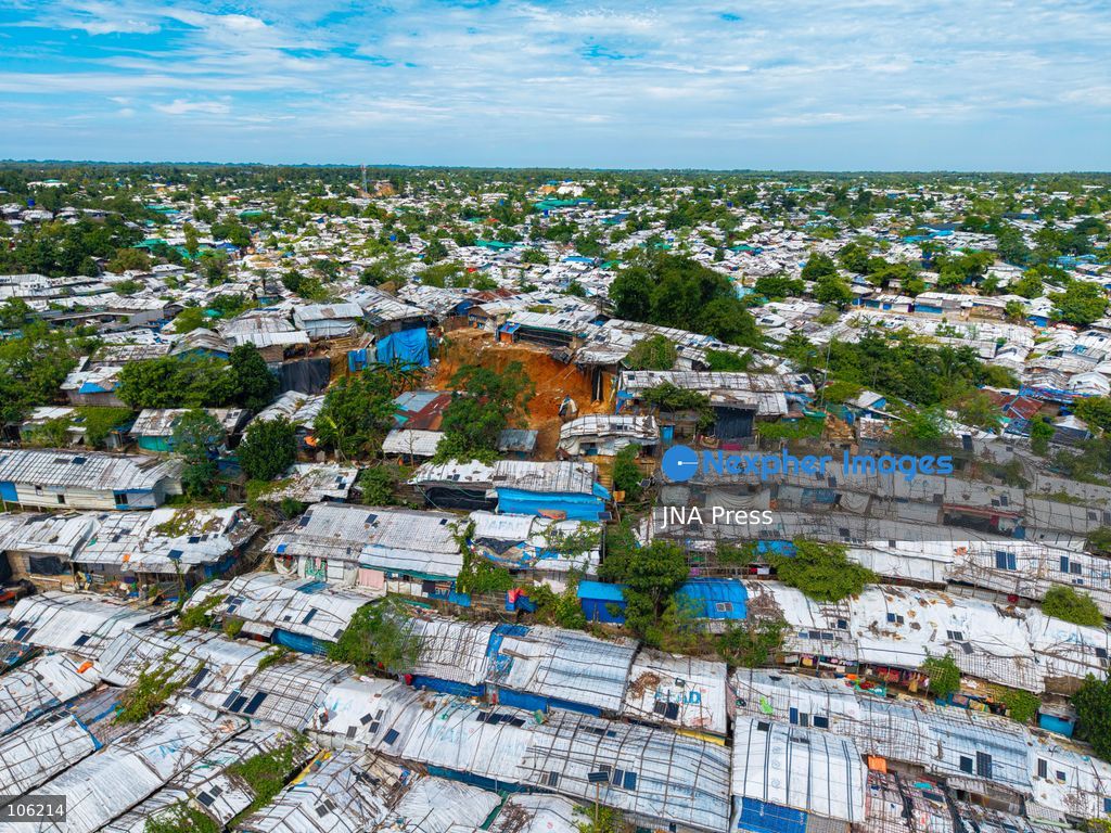 UKHIYA, COX’S BAZAR, BANGLADESH — OCTOBER 14, 2026: Aerial views show densely packed shelters and winding pathways across the Kutupalong Rohingya refugee camp in Ukhiya, Cox’s Bazar, Bangladesh. The photographs document the extensive settlement, where thousands of shelters are clustered across a hilly landscape interspersed with vegetation and access roads. (Photo by Istiyak Ahamed Srabon/JNA Press via Nexpher Images)