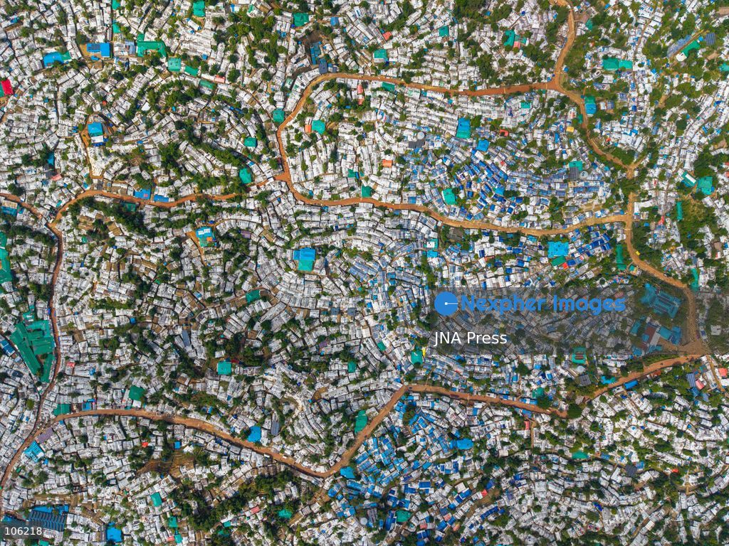 UKHIYA, COX’S BAZAR, BANGLADESH — OCTOBER 14, 2026: Aerial views show densely packed shelters and winding pathways across the Kutupalong Rohingya refugee camp in Ukhiya, Cox’s Bazar, Bangladesh. The photographs document the extensive settlement, where thousands of shelters are clustered across a hilly landscape interspersed with vegetation and access roads. (Photo by Istiyak Ahamed Srabon/JNA Press via Nexpher Images)
