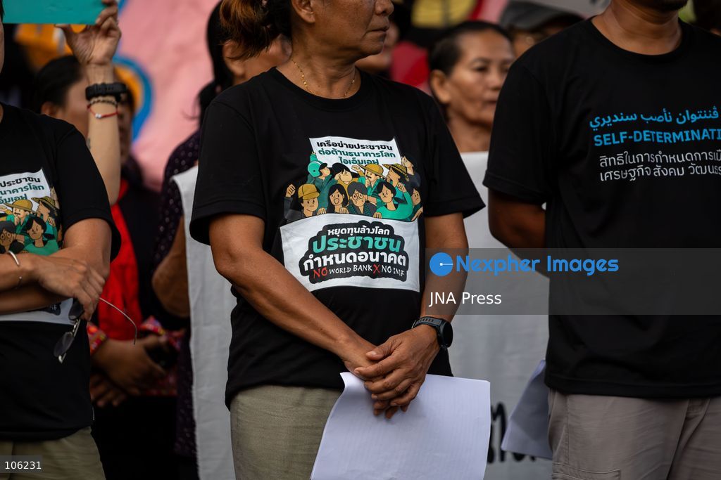 BANGKOK, THAILAND, OCTOBER 15, 2026: Members of the People’s Network Against the World Bank and IMF demonstrate at Rama IV intersection during the annual meetings of the International Monetary Fund and the World Bank Group at the Queen Sirikit National Convention Center. Demonstrators raise concerns over economic inequality, debt and the environmental impact of development policies. Protesters remain at the site during heavy rain as police maintain security around the gathering. Photo by Thanatchanont Jiraworathanakul / JNA Press (Photo by Thanatchanont Jiraworathanakul/JNA Press via Nexpher Images)