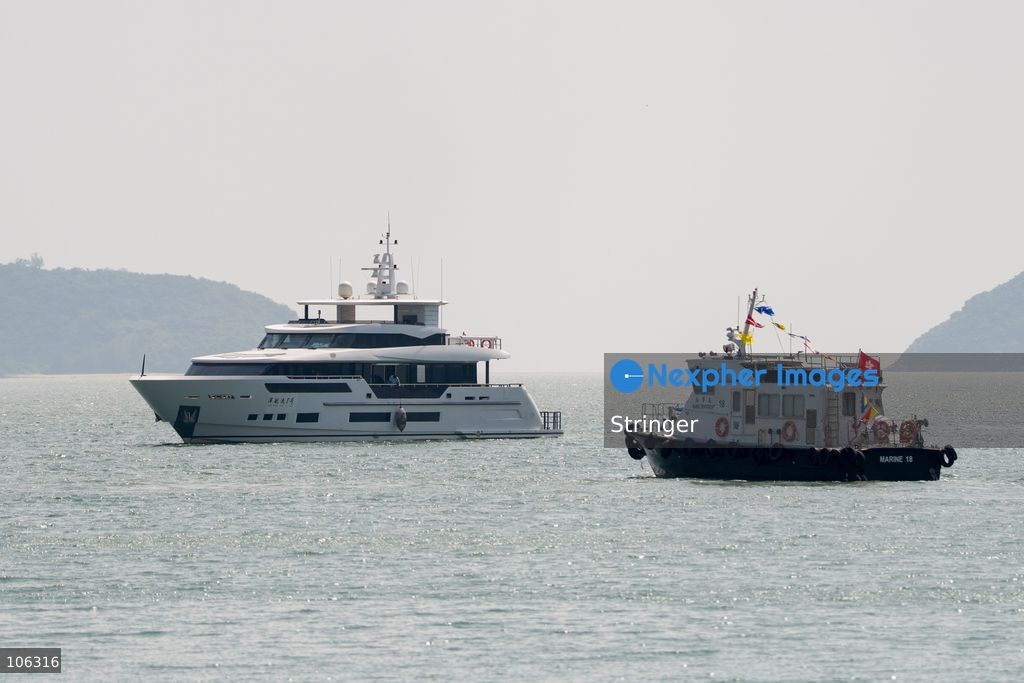 A yacht part of the southbound travel of yachts from Guangdong program arrives at the discovery bay yacht club on October 16, 2026 in Hong Kong. (Photo by Stringer/Nexpher Images)