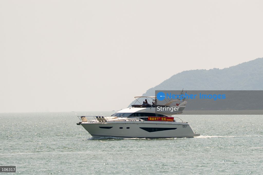 A yacht part of the southbound travel of yachts from Guangdong program arrives at the discovery bay yacht club on October 16, 2026 in Hong Kong. (Photo by Stringer/Nexpher Images)