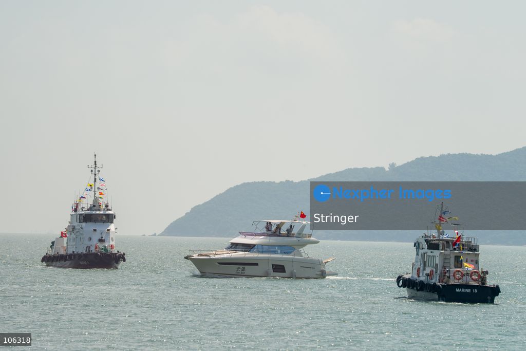 A yacht part of the southbound travel of yachts from Guangdong program arrives at the discovery bay yacht club on October 16, 2026 in Hong Kong. (Photo by Stringer/Nexpher Images)