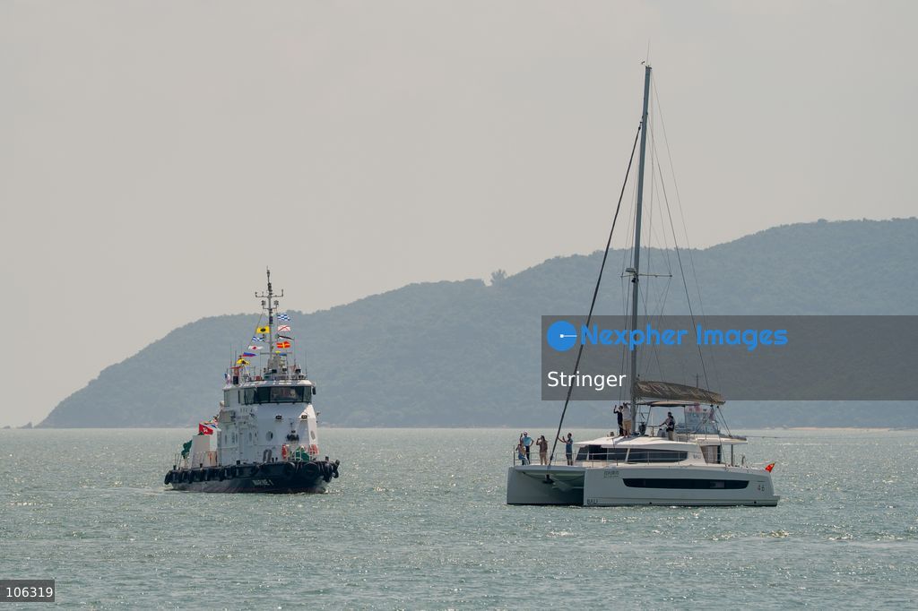 A yacht part of the southbound travel of yachts from Guangdong program arrives at the discovery bay yacht club on October 16, 2026 in Hong Kong. (Photo by Stringer/Nexpher Images)