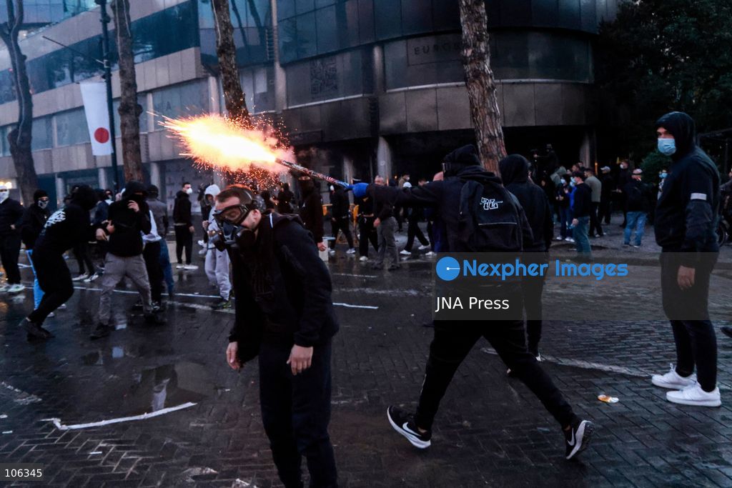 TIRANA, ALBANIA, OCTOBER 15, 2026: Students and other demonstrators protest near the Prime Minister’s Office in Tirana on the third consecutive day of anti-government demonstrations, demanding better university conditions and the resignation of Prime Minister Edi Rama. Clashes erupt between protesters and riot police, with demonstrators throwing stones, metal objects and pyrotechnics while officers respond with tear gas and water cannons. Fires are set in rubbish bins and at street kiosks, and damaged public property and debris are scattered across central Tirana. Some demonstrators are detained, while others help protesters affected by tear gas by pouring water over their faces to rinse their eyes. A bloodied female demonstrator is held on the ground by other protesters amid the confrontations. Photo by Vlasov Sulaj / JNA Press (Photo by Vlasov Sulaj/JNA Press via Nexpher Images)