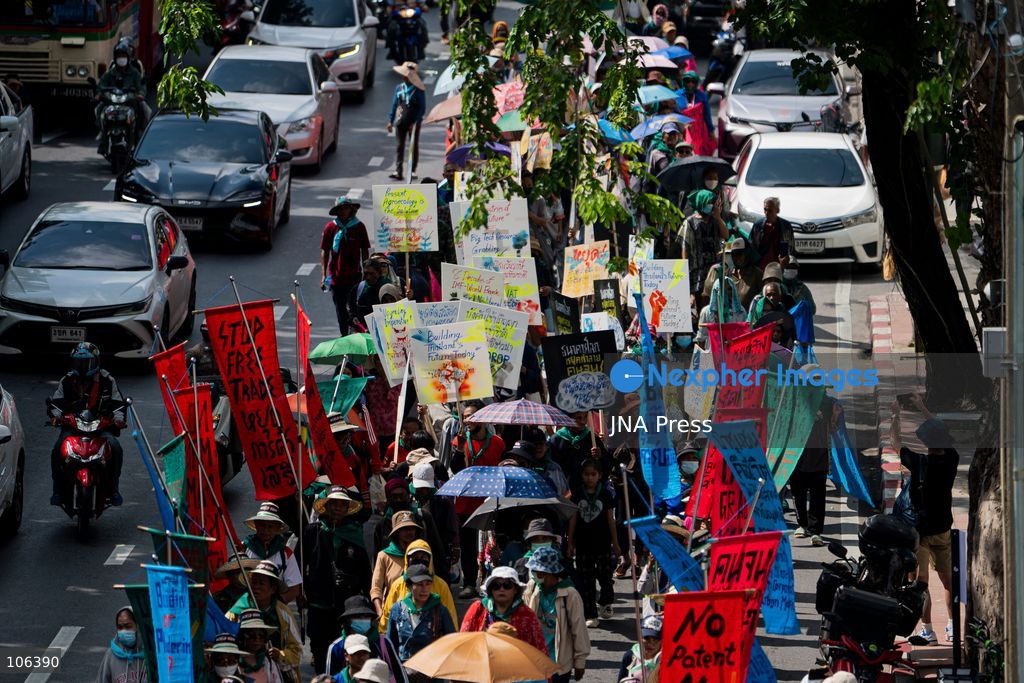 BANGKOK, THAILAND, OCTOBER 16, 2026: Members of Thailand’s Assembly of the Poor and allied community networks march towards the Queen Sirikit National Convention Center during a protest against the annual meetings of the International Monetary Fund (IMF) and the World Bank in Bangkok. Protesters representing communities affected by dams, farmers’ debt groups and other local networks carry banners and call for greater public participation in economic decision-making. They present six demands, including debt cancellation for low- and middle-income countries facing debt crises, public scrutiny of government foreign borrowing, an end to subsidies for large corporations, progressive taxation and more democratic and transparent central banks. Police maintain a heavy security presence along the protest route and around the meeting venue. Photo by Captain Jirathummanuwat / JNA Press (Photo by Captain Jirathummanuwat/JNA Press via Nexpher Images)