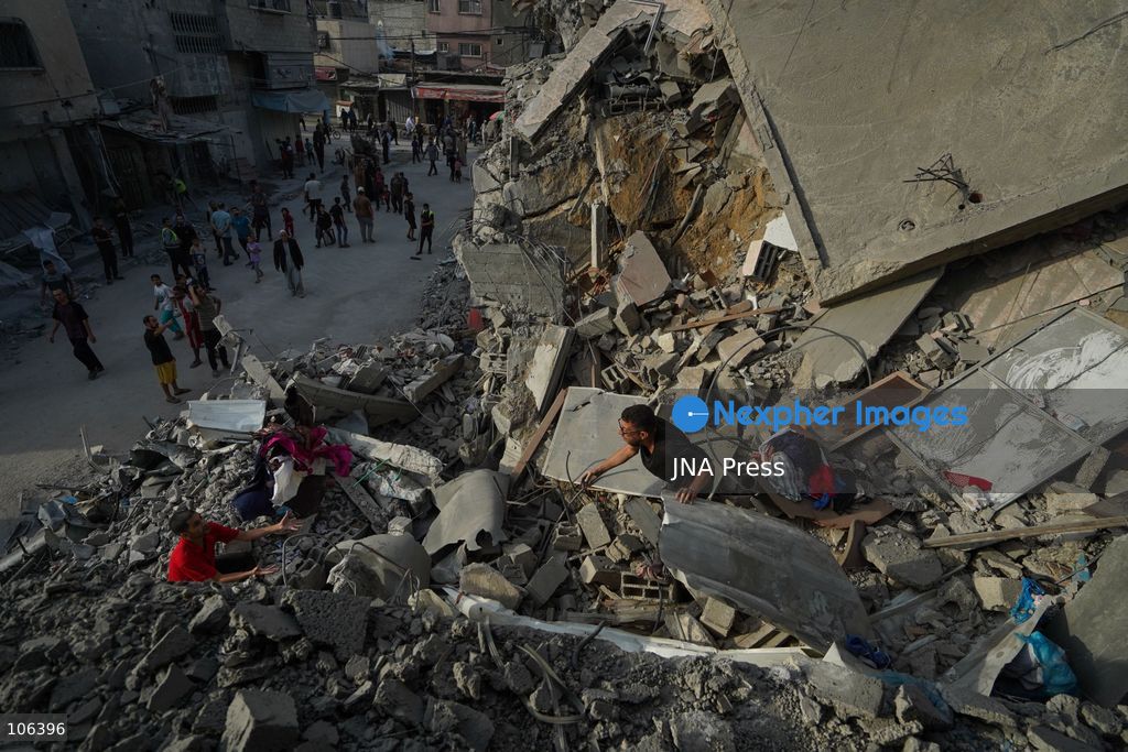 MAGHAZI REFUGEE CAMP, GAZA STRIP, PALESTINE, [MONTH DAY, YEAR]: Destruction following Israeli airstrikes that hit homes belonging to the Saada and Abu Muaileq families in Maghazi refugee camp in the central Gaza Strip. The strikes on October 15 destroyed both homes and caused extensive damage to surrounding residential buildings. Photo by Ramzi Abu AMER/ JNA Press. (Photo by Ramzi Abu Amer/JNA Press via Nexpher Images)