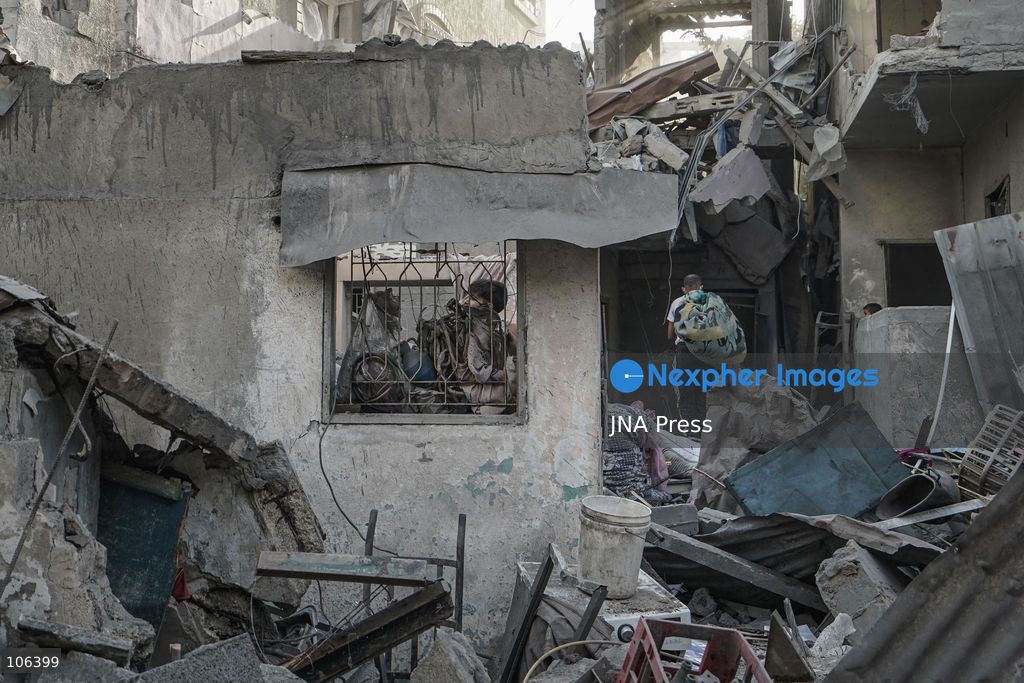 MAGHAZI REFUGEE CAMP, GAZA STRIP, PALESTINE, [MONTH DAY, YEAR]: Destruction following Israeli airstrikes that hit homes belonging to the Saada and Abu Muaileq families in Maghazi refugee camp in the central Gaza Strip. The strikes on October 15 destroyed both homes and caused extensive damage to surrounding residential buildings. Photo by Ramzi Abu AMER/ JNA Press. (Photo by Ramzi Abu Amer/JNA Press via Nexpher Images)